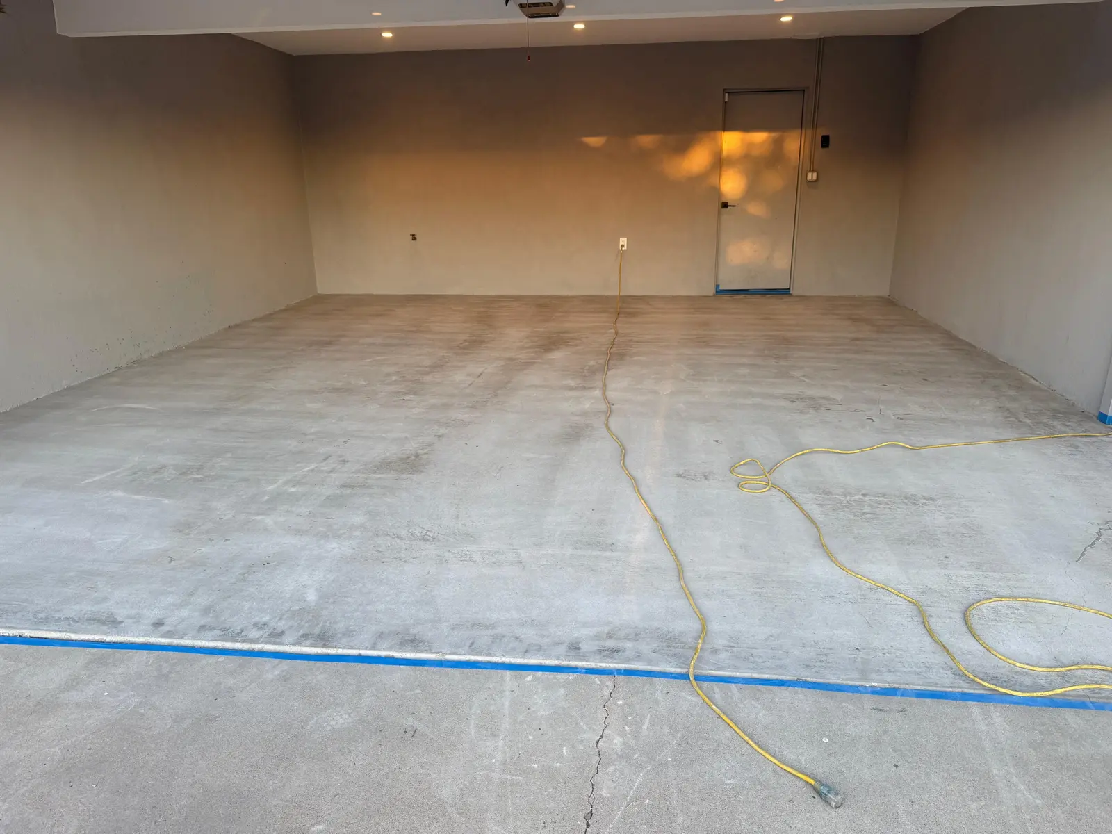 Before: garage floor before epoxy coating in Phoenix, AZ